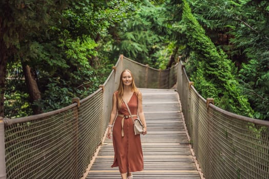 Woman tourist in Rope bridge in Yildiz Park. Besiktas, Istanbul, Turkey. Turkiye.