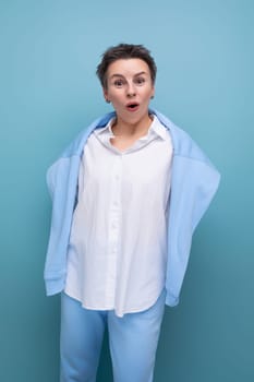 shocked brunette with hair sticking out young woman in casual look.