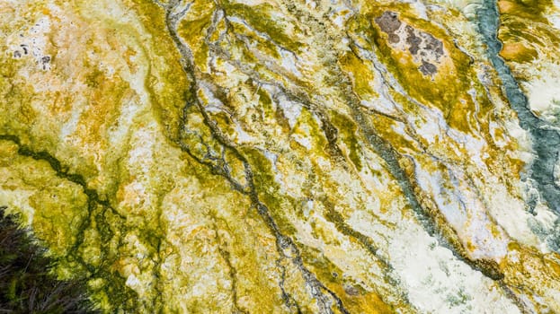 Geothermal landscape with hot boiling sulphur river and springs due to volcanic activity. Sipoholon Hot Spring. Sumatra, Indonesia.