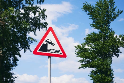 Unprotected quayside or riverbank, warning sign. Road Ends Sign