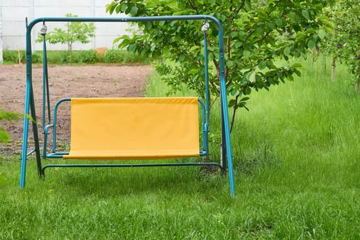 a long plank balanced in the middle on a fixed support, on each end of which children sit and swing
