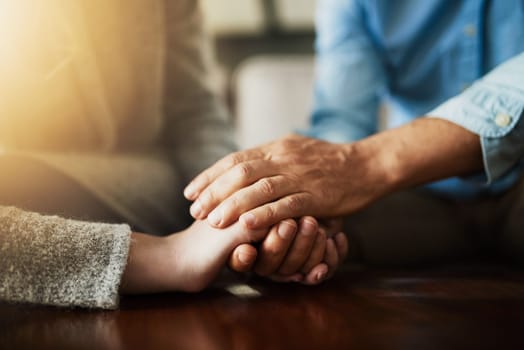 Holding hands, senior couple and life insurance support with kindness in a house. Home, love and elderly people with empathy, hope and trust with solidarity for grief care and marriage together.