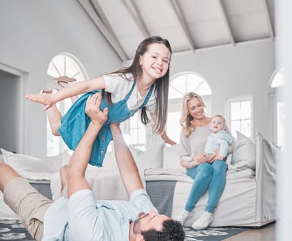 Happy, airplane and family playing in the living room together while bonding in their modern home. Happy, smile and parents relaxing with their children with love, care and happiness in a house