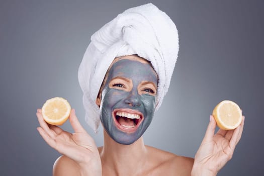 Lemon mask, clay and woman for healthy facial, beauty portrait and anti aging wellness makeup in studio. Happy female model, citrus fruits and vitamin c for charcoal product, shower and laughing face.