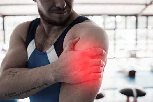 Shoulder pain, sport injury and man with fitness, muscle tension and hand, gymnast at gym and red overlay. Sports accident, medical emergency and person at gymnastics, competition and inflammation.