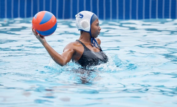 Water polo, woman and ball in pool for game, training or competition with fitness, vision or goal. African athlete, sports and college with splash, wellness or strategy for motivation, aim and focus.