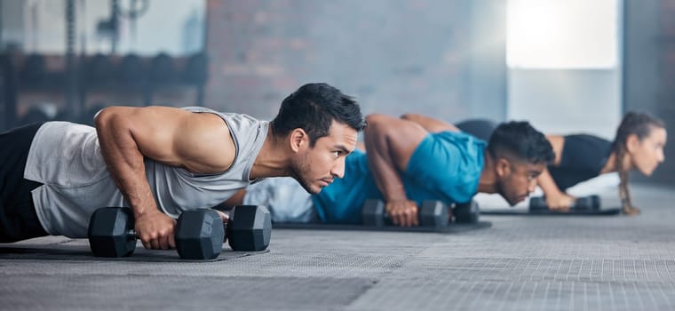 Men, woman and dumbbells in gym workout, training and fitness exercise for health wellness, strong biceps or abs muscles. Personal trainer, coach or weightlifting class friends with motivation goals.