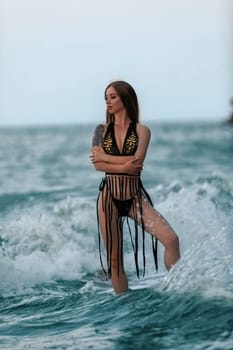 Model pose in modern swimwear by sea. Beautiful sexy lady on tropical beach. Relax portrait of young sunbathing beauty. Summer vibes on the beach