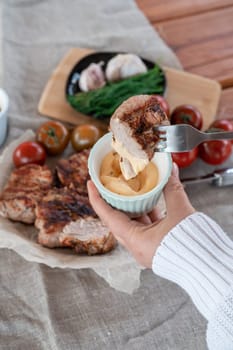 Grilled pork meat in foil with flapjack and vegetables. Summer rest concept