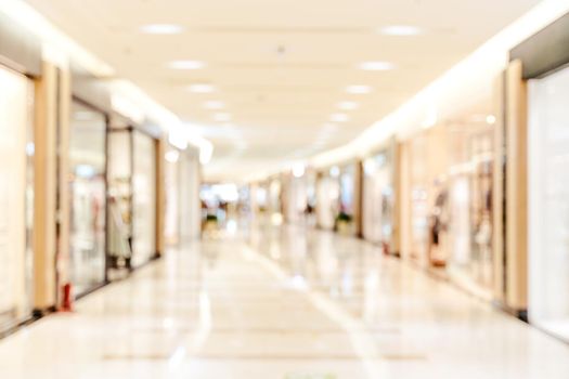 Luxury department store shopping mall interior, abstract defocused blur with bokeh background, concept of shopping seasons design.