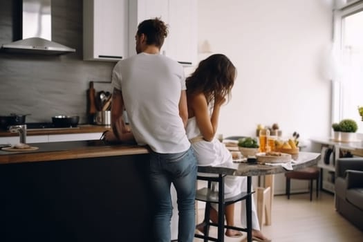 Beautiful young couple preparing a healthy meal together while spending free time at home. Secret ingredient is love. High quality image