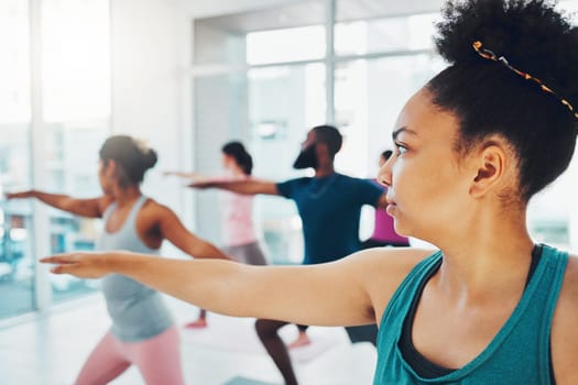 Yoga, exercise class and fitness people in warrior or stretching for health and wellness. Diversity men and women group together for workout, training or pilates for healthy lifestyle motivation.