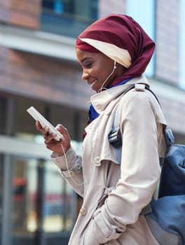 Smile, phone or travel black woman in city typing and walking, networking or on 5g mobile app in New York. Independent professional in the street on smartphone for communication or commute to office.