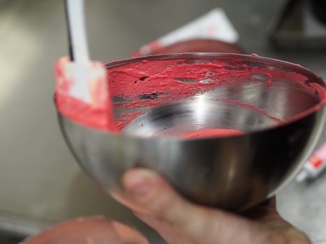 chef preparing white pink red cake creamy mixtures doughs to bake in the oven