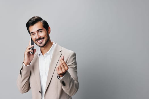 man copy white holding happy smile trading blogger hold cell entrepreneur phone suit smartphone guy portrait confident business beige application space call
