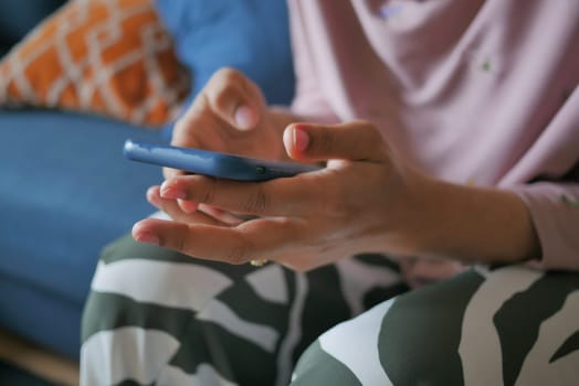 close up of women hand holding smart phone.