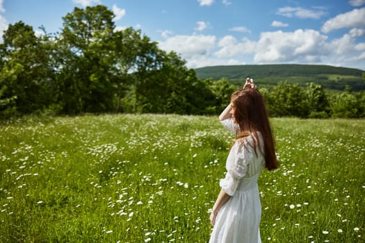 portrait of a woman in a light dress in a chamomile field turning her face away from the camera. High quality photo