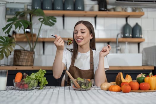 Vegetable woman relaxes at home, cooks in kitchen. Healthy concept holiday week.