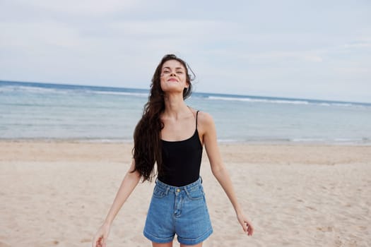 active woman smile flight vacation sunset hair young happiness walking travel beauty sea person running lifestyle long summer beach beautiful positive body