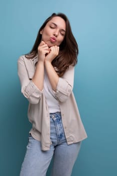 coquette romantic young brunette woman in shirt and jeans.