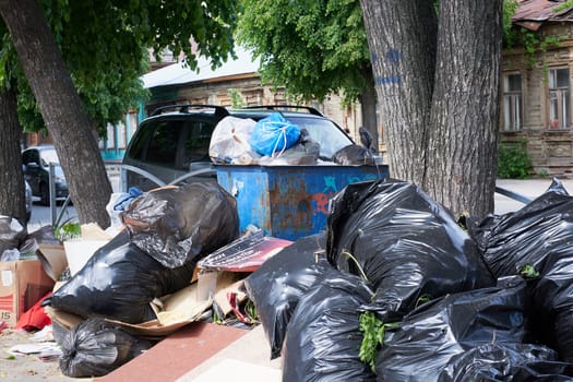 Ryazan, Russia - May 22, 2023: A pile of various garbage on a city street