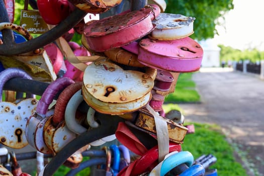 Ryazan, Russia - May 22, 2023: Lots of old love padlocks close up