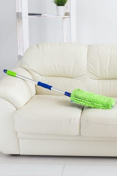 New clean green microfiber mop floor wiper cleaning sweeping tool lying sofa