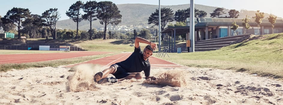 Athlete long jump, sand and sports man training for France olympic competition, workout challenge or fitness exercise. Winner mindset, commitment and athletics person working on leg power performance.