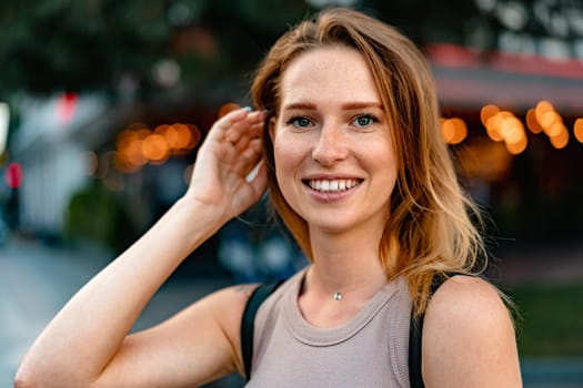 Portrait of a beautiful young woman outdoors in the city