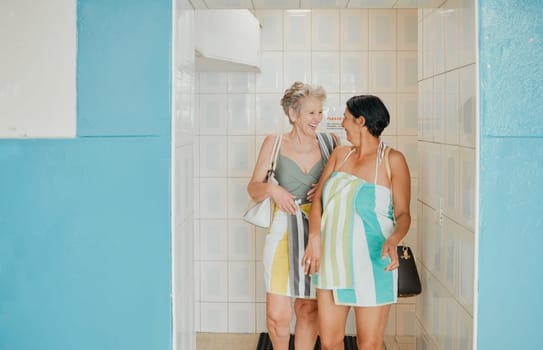 Excited, communication and senior women going swimming on a holiday together. Training, happy and elderly friends ready in a bathroom to swim on a vacation to relax, peace and smile in retirement.