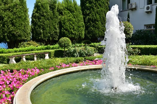 Partenit, Crimea - July 8. 2019. The round fountain in Park landscape art Aivazovskoe