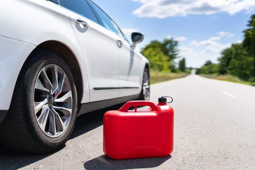 Empty car tank from a red canister on the side of the road. Fuel problem. Place for an inscription