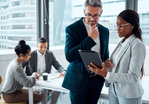 Tablet, business people and discussion with ceo, planning or collaboration. Technology, teamwork and black woman with mentor in conversation, communication or research, strategy or talking in meeting.