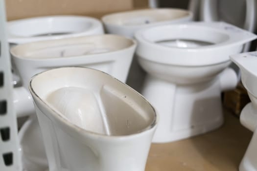 Lot of white toilets in a hardware store, plumbing department