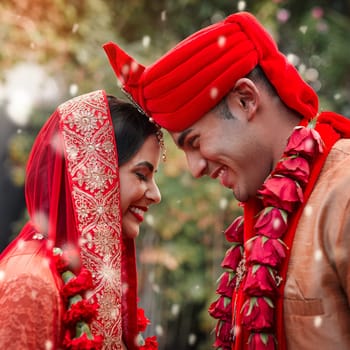 Wedding, marriage and hindu couple together in celebration of love or commitment at a ceremony. Happy, romance or islamic with a birde and groom getting married outdoor in tradition of their culture.