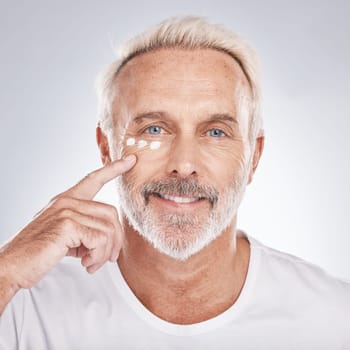 Skincare, beauty and senior man with cream on white background for beauty, wellness and dermatology. Cosmetics, grooming and elderly male with anti aging beauty products, facial treatment and lotion.