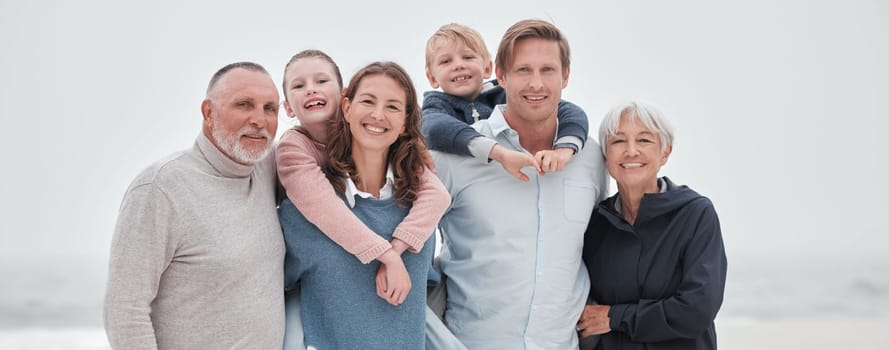 Family, children and beach with parents, grandparents and kids outdoor together while on holiday or vacation. Travel, love and bonding with a senior man, woman and grandkids spending time on a coast.