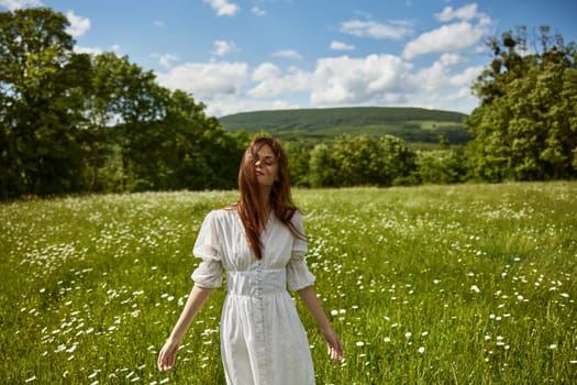 portrait of a woman in a light dress in a chamomile field turning her face away from the camera. High quality photo