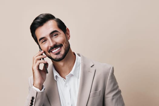 portrait man hold businessman smile phone cellphone suit guy white trading online copy happy gray call space lifestyle success communication business smartphone