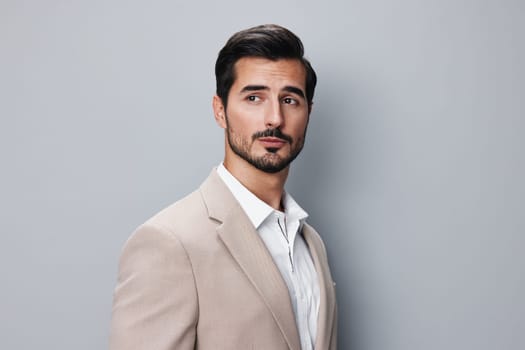 business man stylish portrait studio fashion beige happy copyspace standing tie formal occupation handsome suit attractive job sexy confident businessman smiling