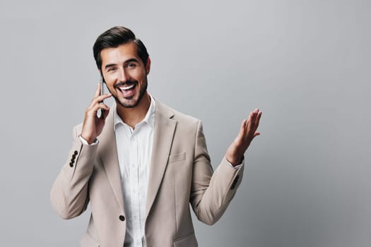 man person hold call selfies smile phone young technology smartphone isolated confident portrait suit application studio internet corporate business happy message