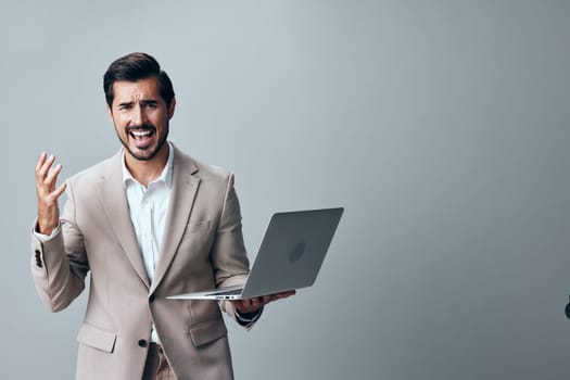 man suit handsome freelancer person professional laptop internet notebook portrait job typing smiling smile work copyspace manager white model business computer