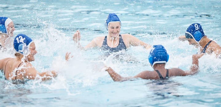 Water polo, woman team and pool for celebration, game or competition for success, teamwork and goals. Women group, aqua sports and college with splash, ball and winning in match, contest and happy.