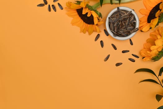 Sunflower seeds in blow on yellow background with space for your text. Organic product and vegan food concept.