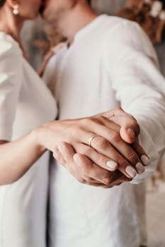 men woman holding hands. Couple holding hands close-up, bride and groom's hands.