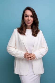 portrait of a cute brunette woman in a white dress with pleasant features.