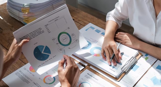 Business team analyzing income charts and graphs with modern laptop computer. Close up. Business analysis and strategy concept.