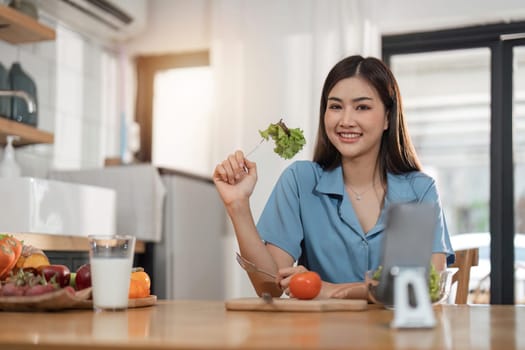 Beautiful Asian woman in kitchen at home. Health care concept. relaxation concept.