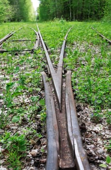 An abandoned old railway in the middle of the forest