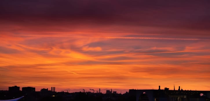 Silhouette of city at sunset sky background